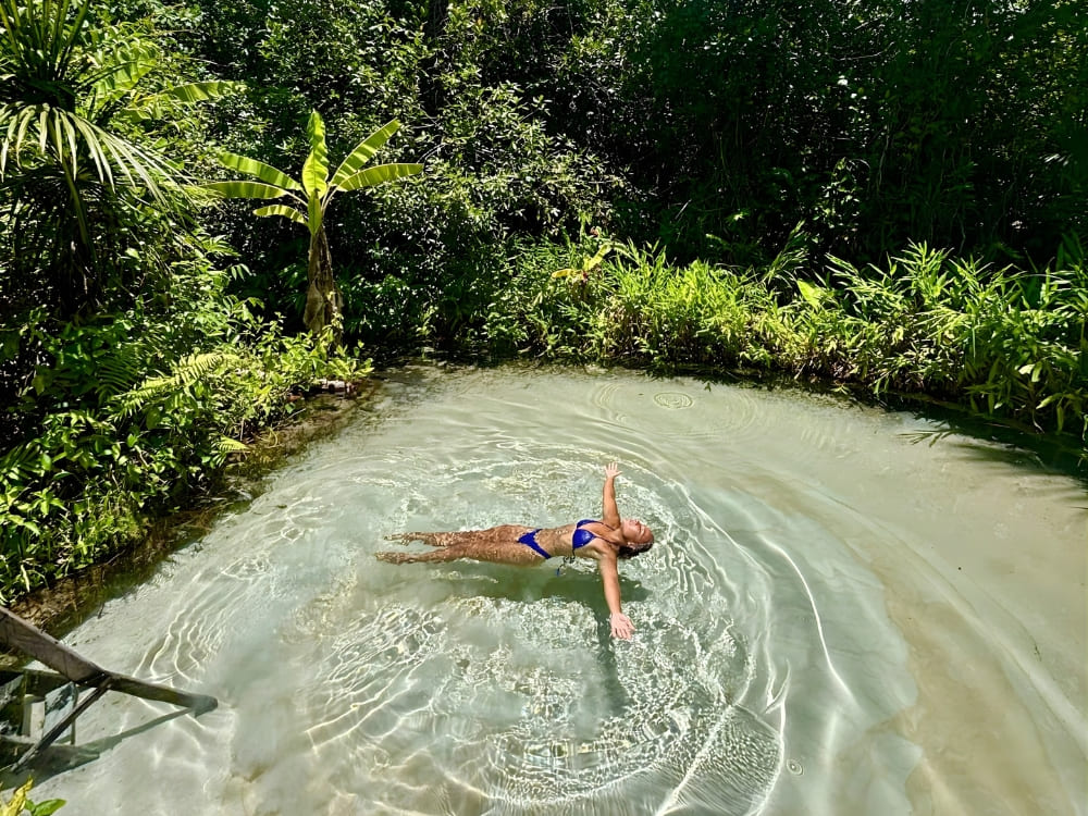 Samantha Sage floats peacefully on her back in the crystal-clear waters of the Jalapão, Brazil. Samantha Sage floats peacefully on her back in the crystal-clear waters of the Jalapão, Brazil.
